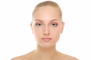 Close-up of a woman's face post-blepharoplasty, showcasing subtle enhancements to eye size and overall facial appearance.